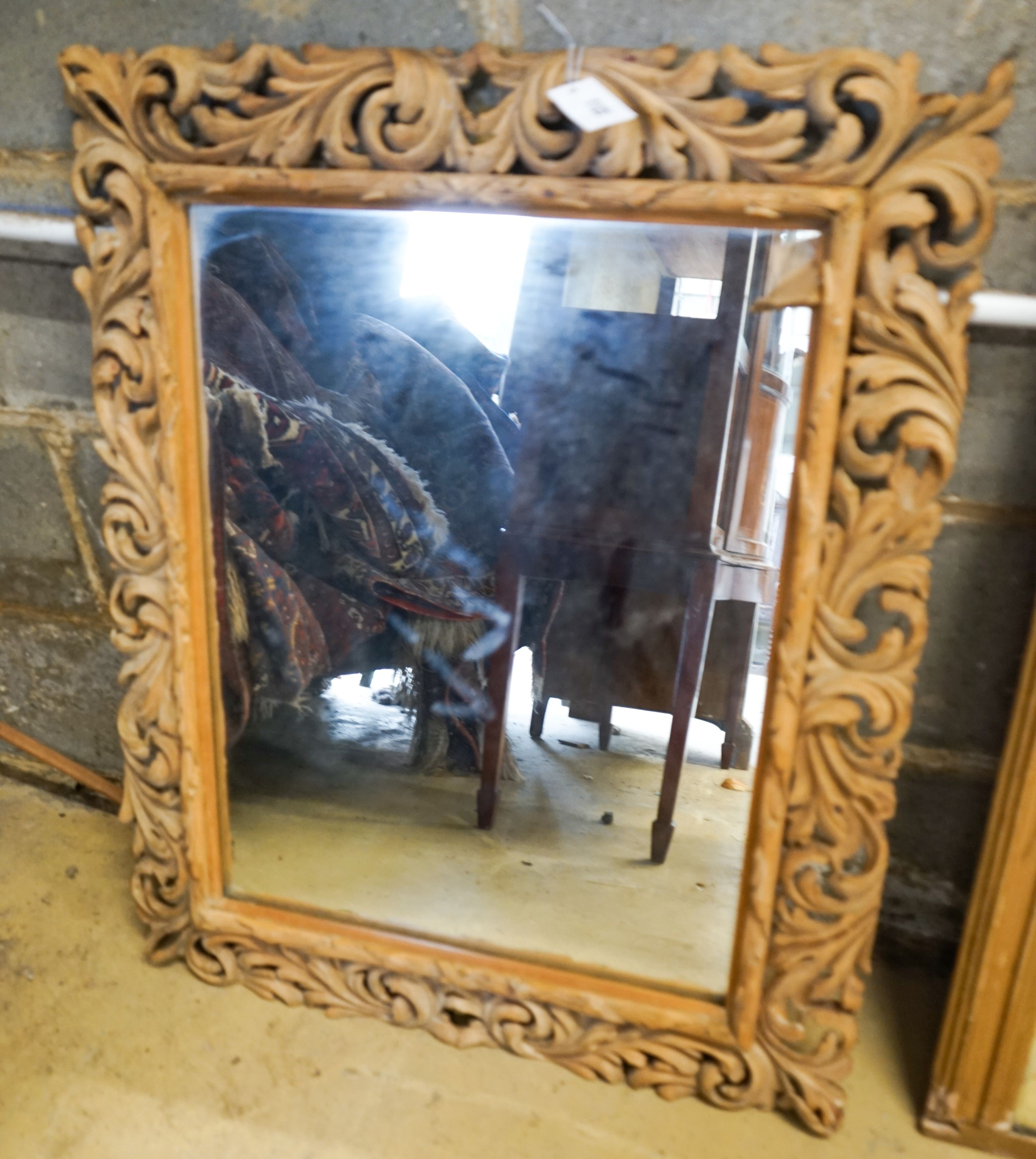 A carved oak framed rectangular wall mirror, width 65cm, height 82cm